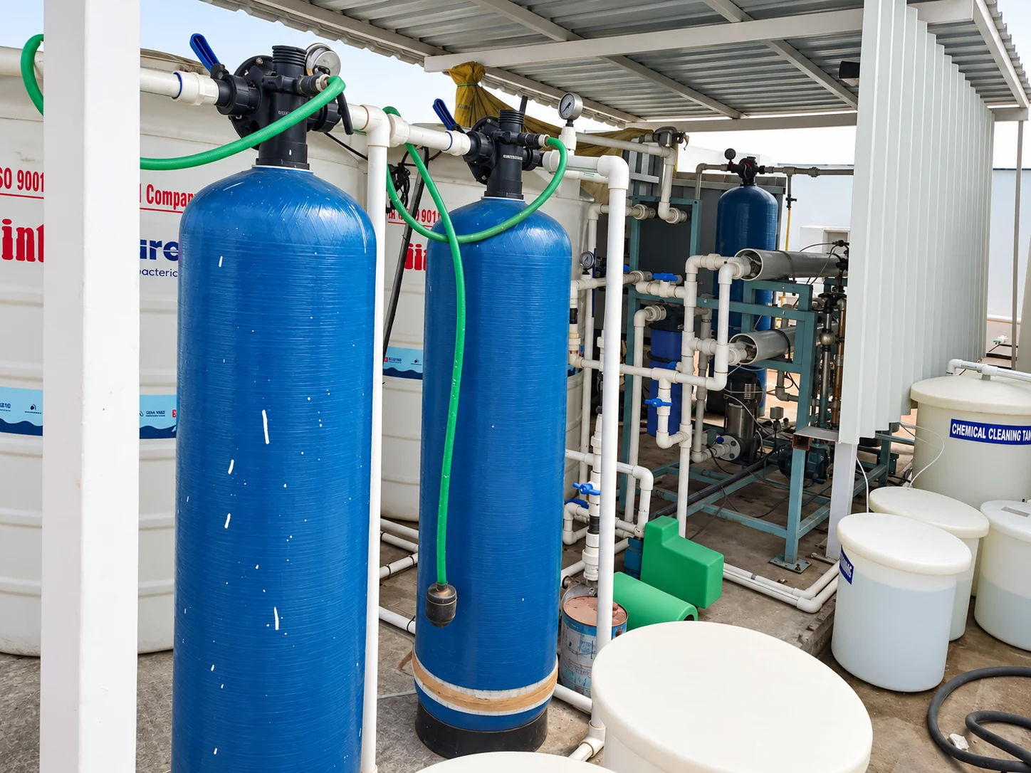 Sheltered water treatment plant with blue filter vessels, membrane housings and connected pipework